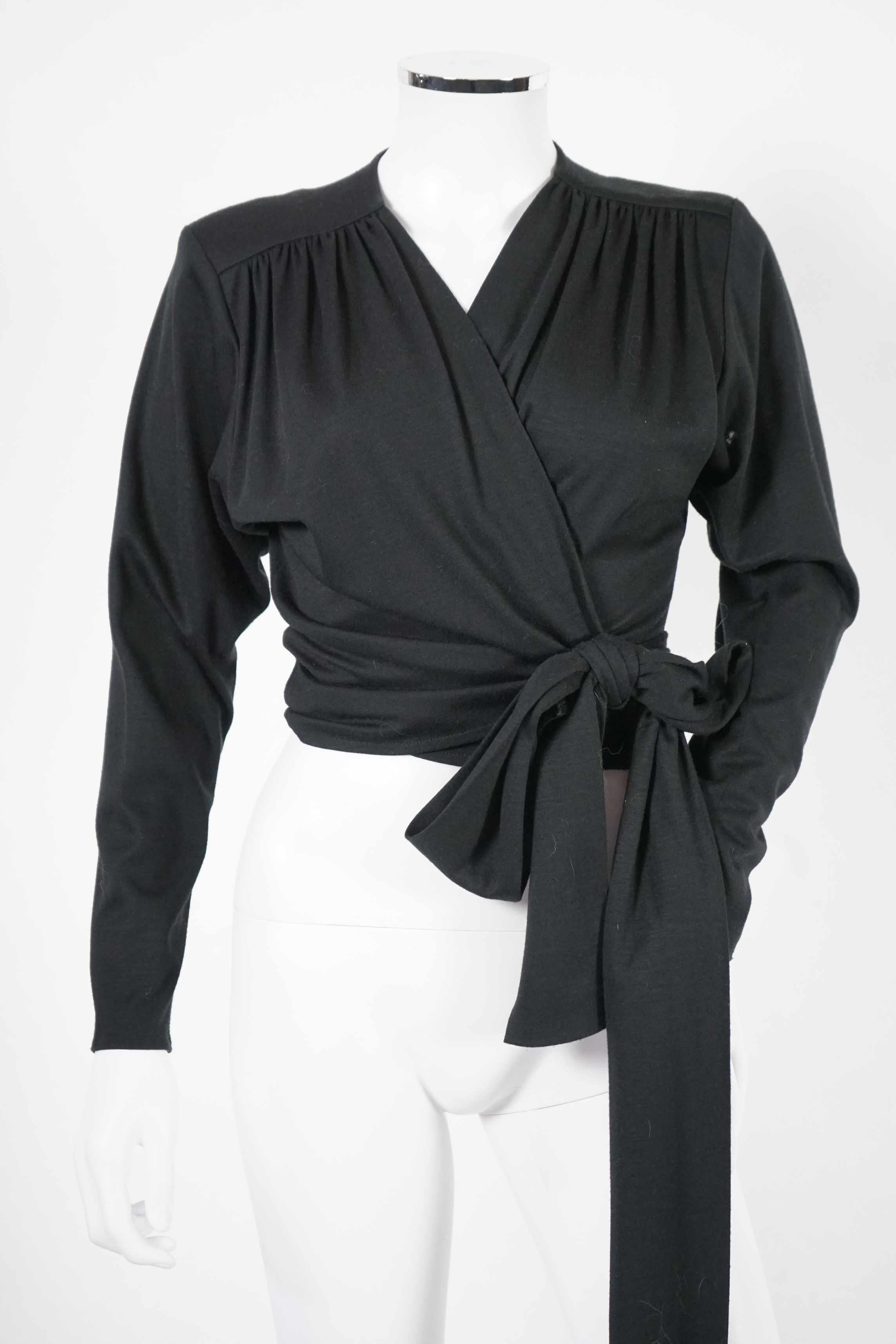 Four vintage Yves Saint Laurent variation lady's tops, F 40 (UK 12).Proceeds to Happy Paws Puppy Rescue